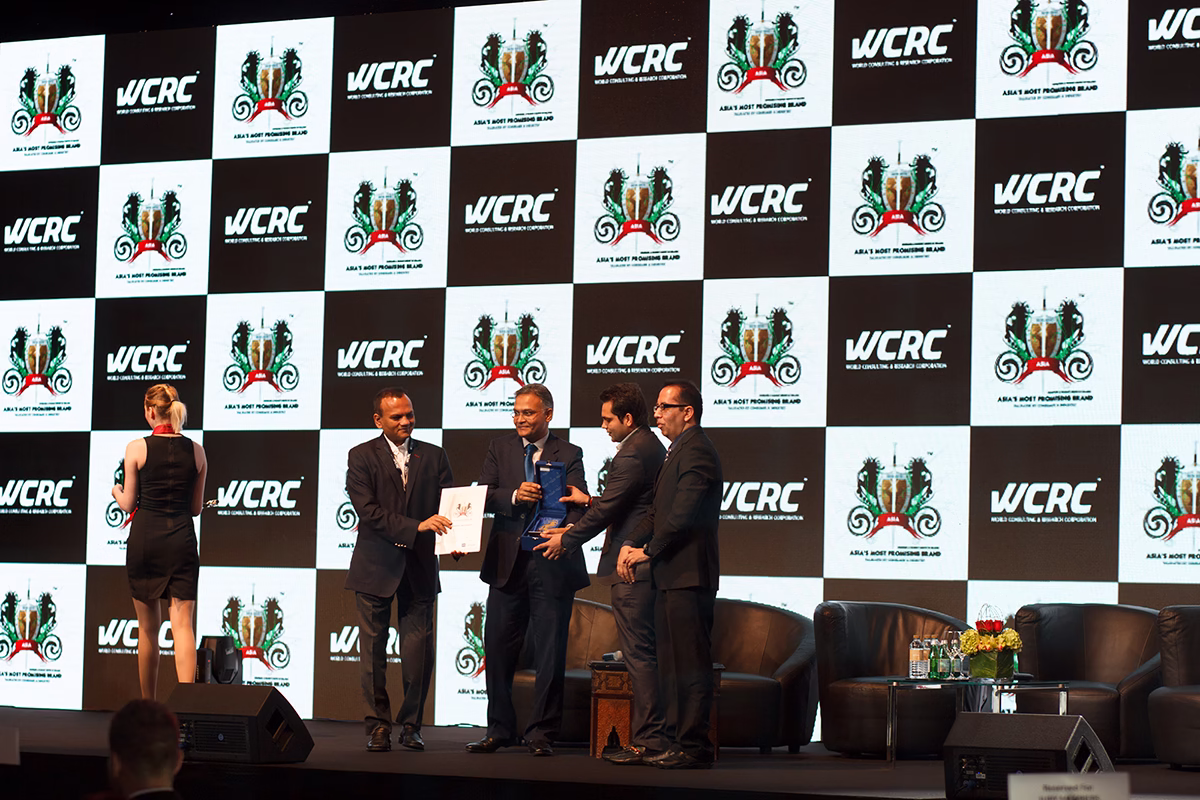 WCRC Leaders awards — an honouree receiving the Asia's Most Promising Brand citation on the WCRC branded stage in Dubai